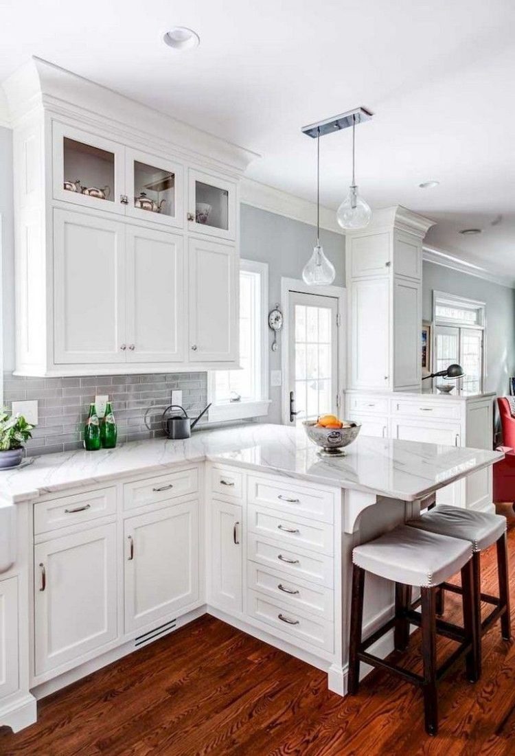 white kitchen cabinets with crystal knobs