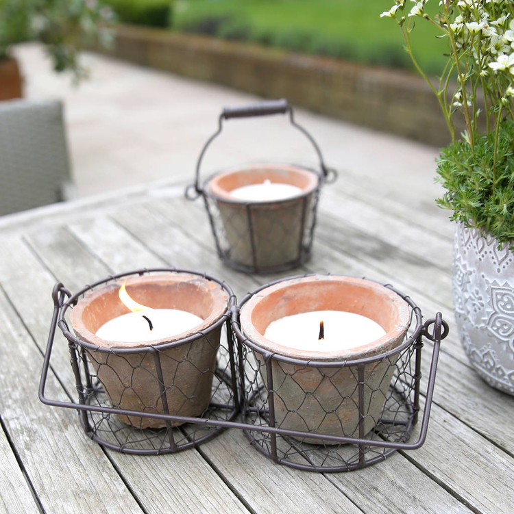 citronella candles in buckets